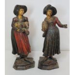 Pair of 19th century Continental carved wooden figures of two women holding sheep, standing on