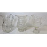 Three 19th century cut glass water jugs, 24cm, 23cm and 22cm high.  (3).