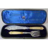 Pair of silver fish servers with ivory handles, the blade and fork with engraved and pierced