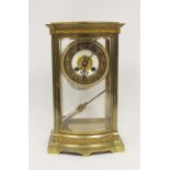 French four glass mantel clock with mercury pendulum in ormolu case with bow front and pierced