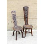 Two carved oak spinning chairs of typical design, one with the back decorated with thistles, the