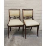 Pair of Regency style side chairs with brass flowerheads, on sabre front supports. 84cm high.