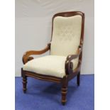 Antique mahogany button back armchair with scroll arms on turned supports