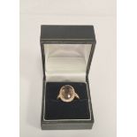 9ct gold ladies cocktail ring with large central Dutch rose cut smokey quartz encircled by diamonds.