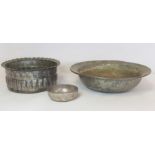 Three Middle Eastern tinned copper bowls, one of circular form with flared rim and incised Arabic
