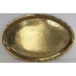 Large Indian brass oval tray with incised panel depicting a royal procession with elephants