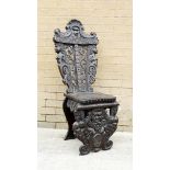 19th century carved walnut Sgabello style hall chair, profusely pierced & carved with mask
