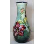 Moorcroft Pottery red and yellow "Hibiscus" pattern tall baluster vase with graduated green