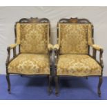 Pair of Edwardian inlaid mahogany wing back salon armchairs chairs raised on slim cabriole supports.