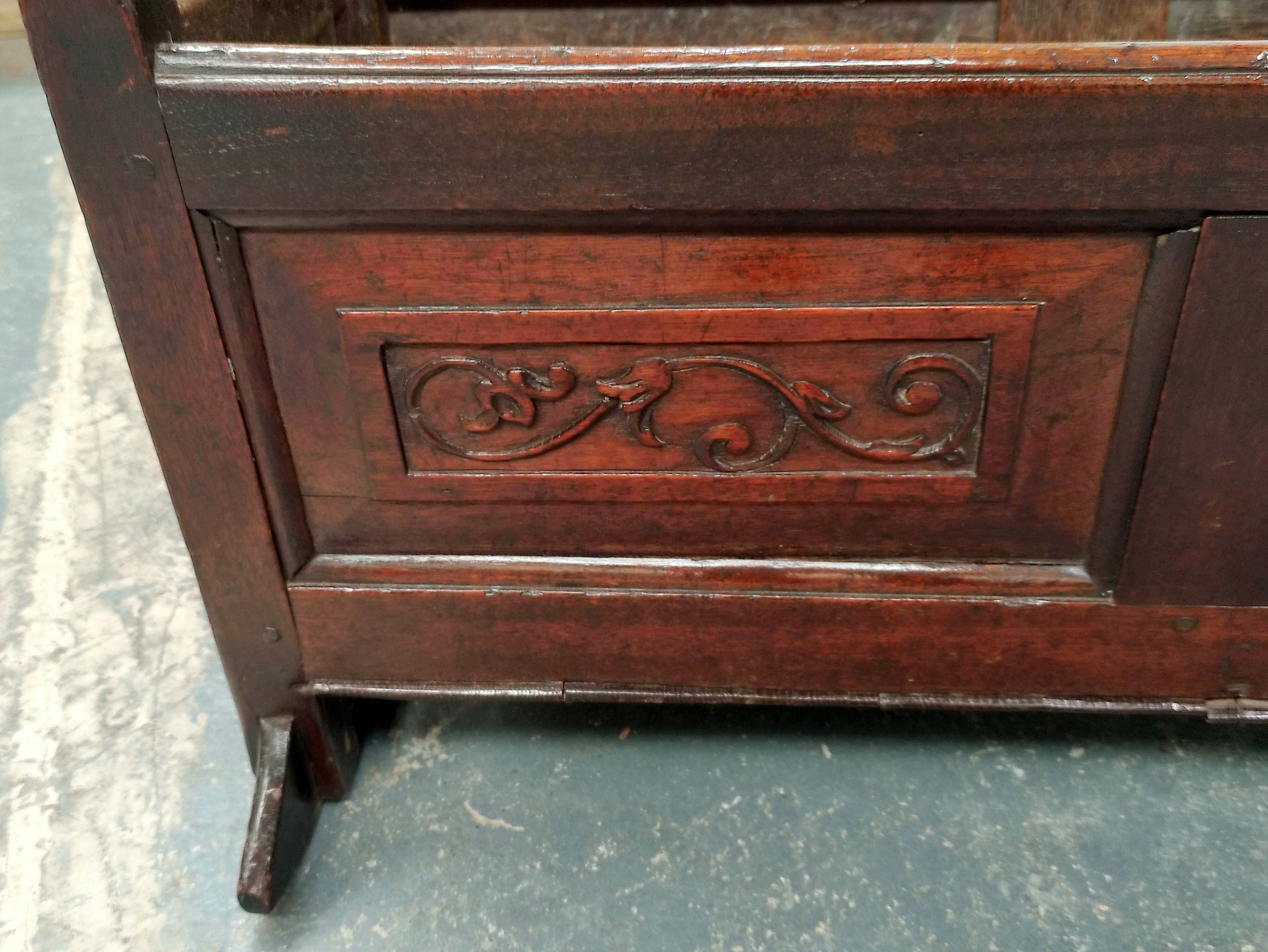 Antique oak cradle, the foliate scroll and stylised flowerhead carved panels with turned knops and - Image 5 of 5