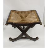 Reproduction Regency style mahogany x-framed stool with bergere caned seat, 53cm
