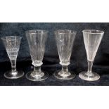 Pair of antique drinking glasses, the tall funnel bowls with moulded fluting on annular knop and