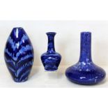 Three Cobridge cobalt blue drip glazed vases designed by Anita Harris, one of ovoid form, 23cm high,