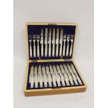 Good set of eighteen silver dessert knives and eighteen forks, engraved, with pearl handles