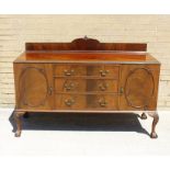 Wylie and Lochhead of Glasgow mahogany sideboard, three central drawers flanked by cupboards, raised