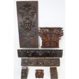 Carved oak panel with Florentine style Green Man mask head, foliate scrolls and harebell drops, 62cm