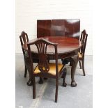 Early 20th century mahogany oval topped moulded edge extending dining table with three additional
