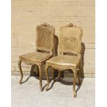 A pair of late 19th century French style ormolu bergere cane backed and seated side chairs, on