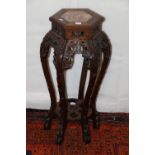 Chinese red hardwood jardinière stand, the inset marble top above carved and pierced frieze,