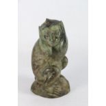 African bronze figure of a seated monkey holding his hands to his face, 16cm