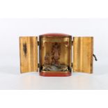 A lacquered zushi or miniature shrine, the doors gilded to the interior and opening to reveal a