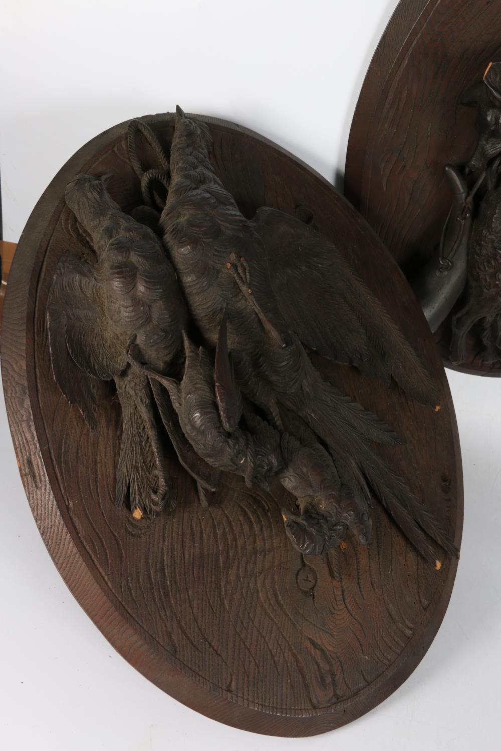 A pair of Black Forest style carved wood hunting trophy plaques with game birds on oval mount, - Image 3 of 8