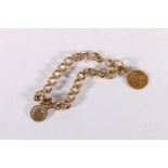 1904 half sovereign on unhallmarked curb link bracelet with 9ct gold Ola Marie Gorie pendant, 29.