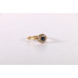 18ct gold sapphire and diamond ring, the stones arranged as a flowerhead, ring size R, 3.2g