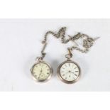 Two antique silver pair cased pocket watches, both having silver watch guards.