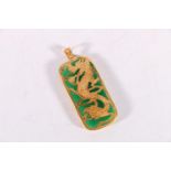 Chinese jade pendant with roll over yellow metal mount depicting a dragon with pearl, 13.5g gross,