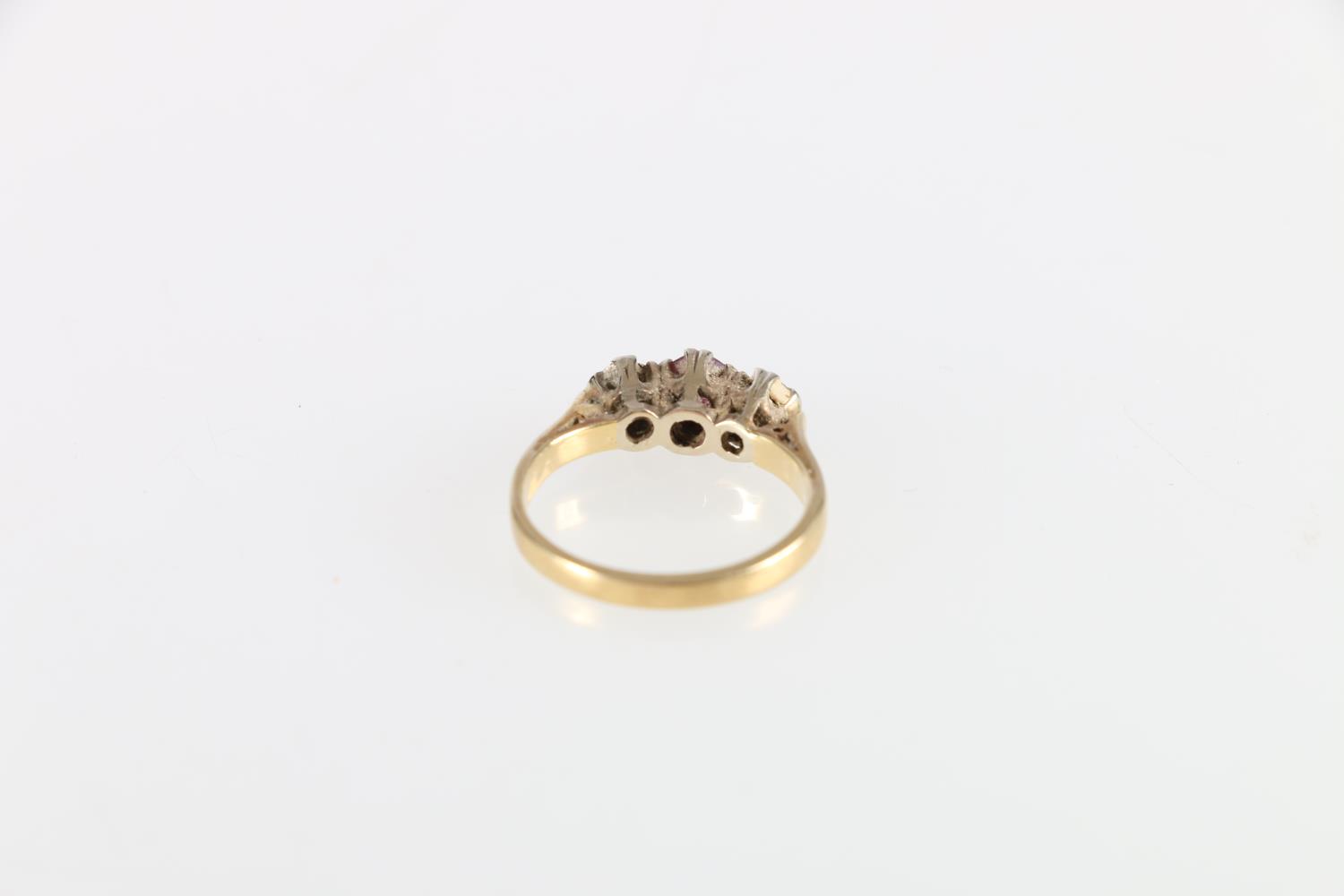 Unhallmarked yellow metal ruby and diamond three stone ring, size K, 3.2g - Image 2 of 2