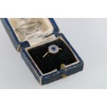 Antique unhallmarked gold sapphire and diamond ring, the stones arranged in a flowerhead design,