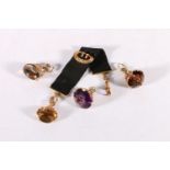 Four 9ct gold mounted faceted citrine and amethyst fobs, 29.7g gross