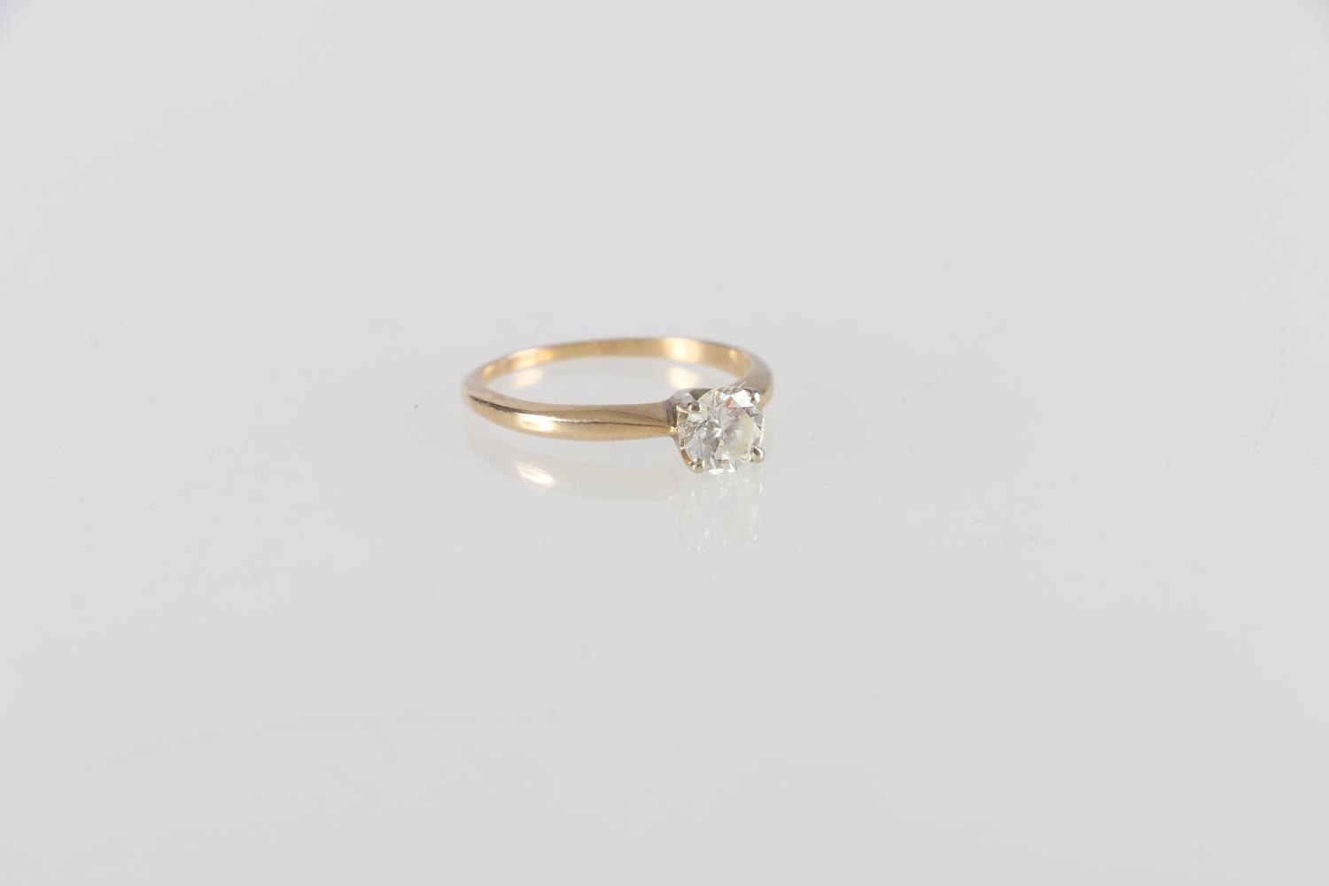 14ct gold diamond solitaire ring, the central round diamond approximately 0.7cts, ring size M, 1.8g