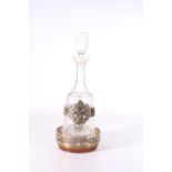 Winchester College interest, a contemporary silver gilt clad cut glass decanter on wide slide