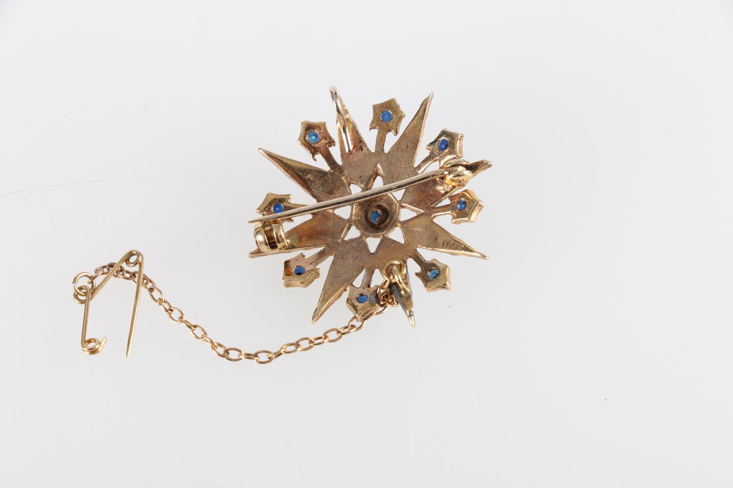 Unhallmarked yellow metal star brooch set with seed pearls and sapphires, makers mark H&SL, 4.9g, - Image 2 of 2