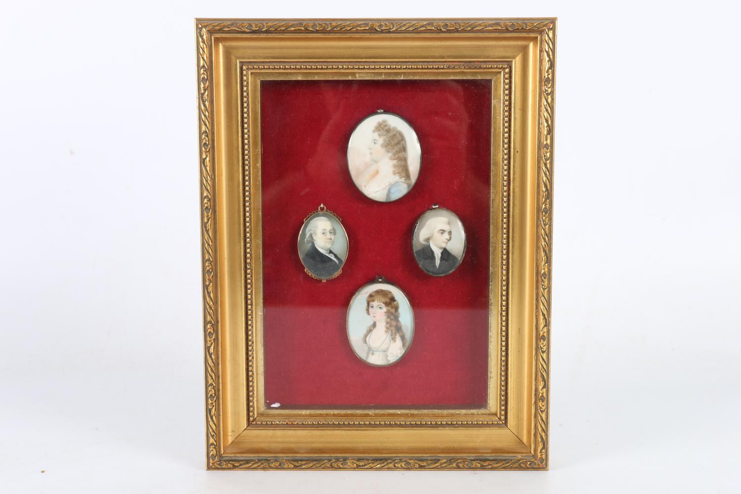Framed display of four antique portrait miniatures, each apparently unsigned, the largest 5.5cm x