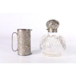 Victorian silver mounted cut glass perfume bottle 11cm tall and a Eastern white metal double measure