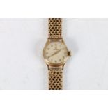 Ladies 9ct gold Omega wristwatch, (cal 244), the 9ct gold strap having unusual fastening clasp.