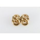 Unhallmarked yellow metal brooch in the form of two pairs of entwined Cs, 12.4g, 3.5cm wide, appears