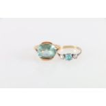 18ct gold ring with large aquamarine faceted stone, the shank of modernist design stamped "K18",