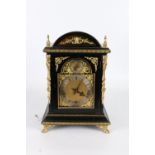 Antique bracket clock held within ormolu mounted ebonised arch top case, the dial with Roman numeral
