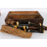Old set of bagpipes, the chanter marked for P Henderson of Glasgow, in hinge topped wooden box, 58cm