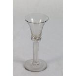 18th century ale glass with spiral clear stem, wide foot and pontil marks, 15.2cm