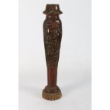 African carved wooden post with religious panels depicting worshippers and a Christ like figure with