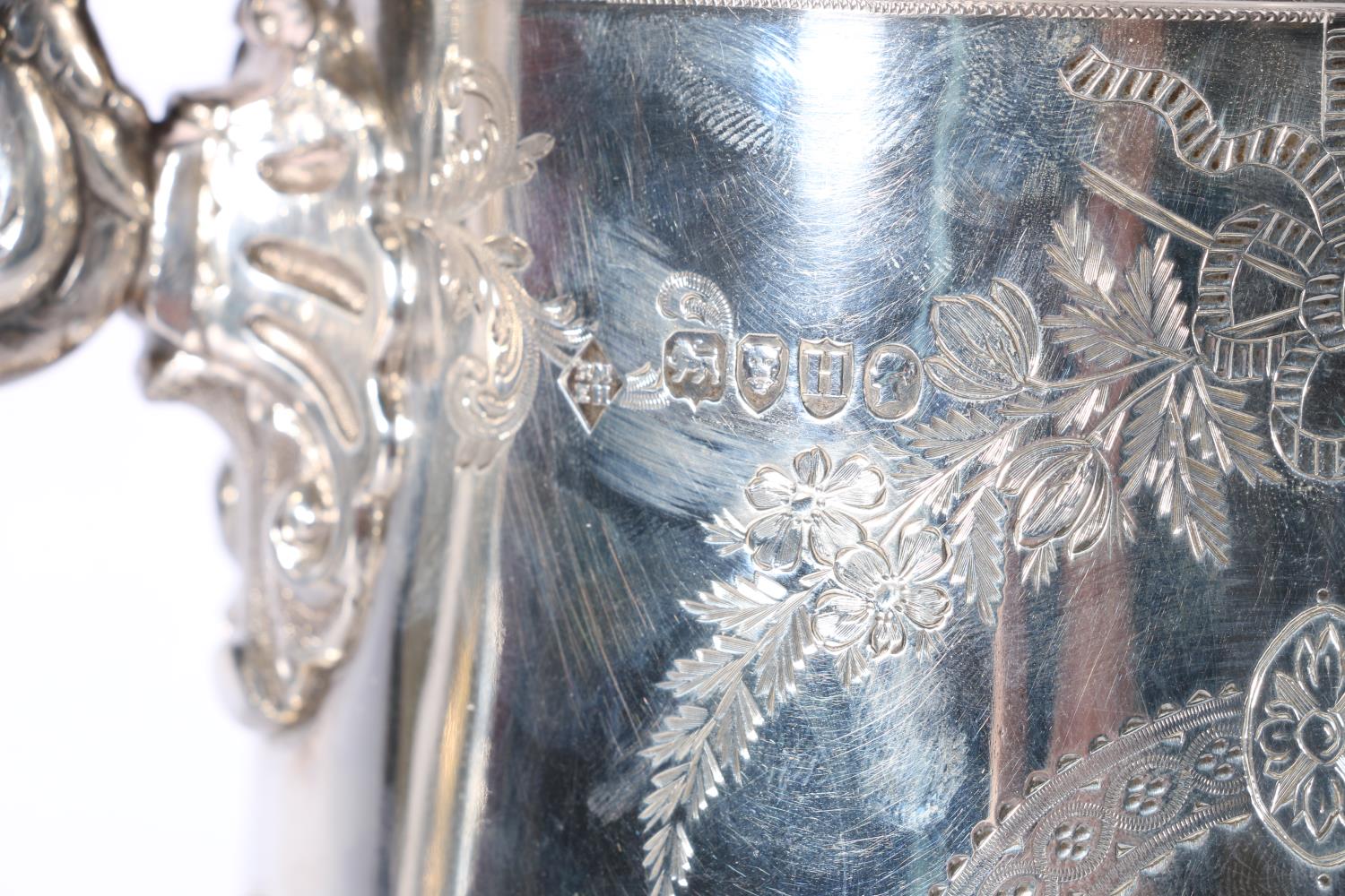 Victorian silver lidded ewer with applied lion masks, shell thumb piece and allover engraved - Image 3 of 5