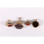 Four 9ct gold mounted bloodstone, agate or amethyst swivel fobs, 23.7g gross