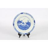 Mid 18th century Bow blue and white plate with central Chinese pavilion pattern within a lotus