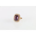 Unhallmarked yellow metal amethyst and pearl dress ring, size K, 6.5g