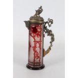 Bohemian ruby flash glass metal mounted ewer, the body depicting a Knight standing resting upon